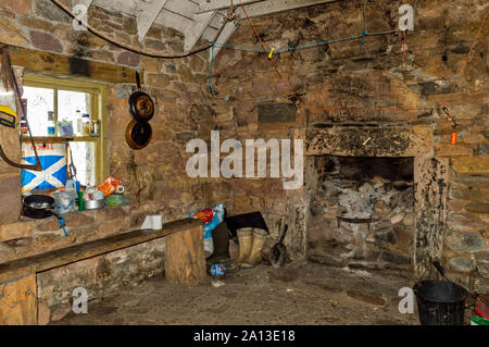 ROSEMARKIE TO CROMARTY WALK BLACK ISLE SCOTLAND INTERIOR OLD STONE BOTHY A REFUGE WITH A FIREPLACE AND COOKING UTENSILS