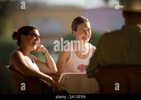 View of three people enjoying themselves. Stock Photo