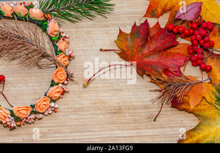 autumn background with colored leaves on wooden board Stock Photo