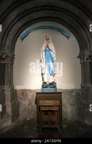 Dinant, Namur / Belgium - 11 August 2019: inside view of the Notre Dame cathedral in Dinant with a biblical sculpture in detail Stock Photo