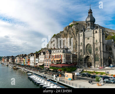 Dinant, Namur / Belgium - 11 August 2019: horizontal view of the Meuse River and the historic old riverside town of Dinant in Belgium