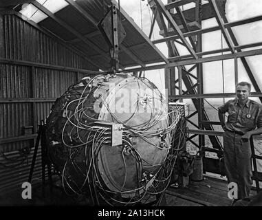 World War II photograph of the Trinity Test bomb partially assembled on the test tower. Stock Photo