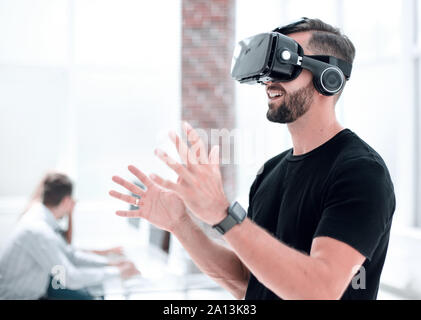 Male handsome patient with modern VR goggles Stock Photo