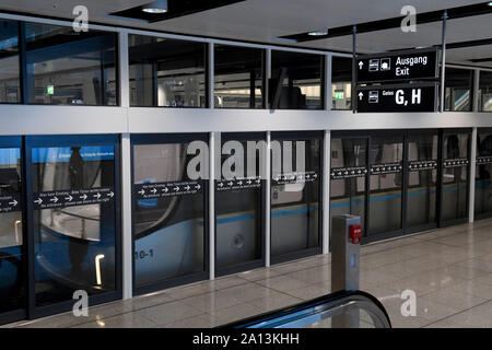 Munich, Germany. 23rd Sep, 2019. A platform connecting the terminals of Munich Airport is secured with a glass wall and extra doors, so that it is not possible to fall into the tracks and fall in front of the train when there is a crowd. Credit: Felix Hörhager/dpa/Alamy Live News Stock Photo