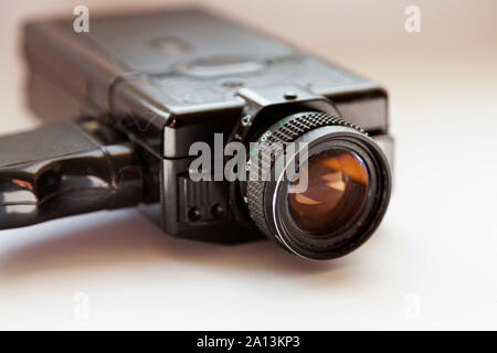 an old film camera for super eight movies, lies on white background Stock Photo