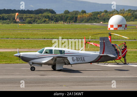 GLOUCESTER, ENGLAND - SEPTEMBER 2019: Turbo Mooney light aircraft taxiing after landing at Gloucester Staverton Airport. Stock Photo