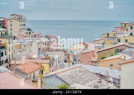 Riomaggiore, Italy- September 17, 2018: View of the city in the Ligurian sea of the ancient and typical Cinque Terre village in summer Stock Photo