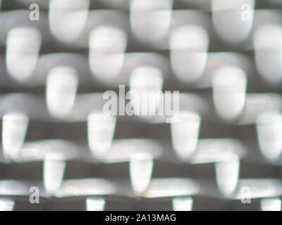 Defocused bokeh light bubbles in shades of grey Stock Photo