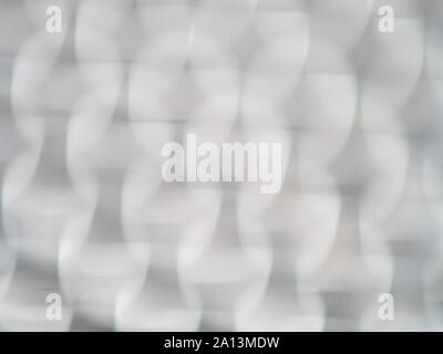 Defocused bokeh light bubbles in shades of grey Stock Photo