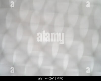 Defocused bokeh light bubbles in shades of grey Stock Photo