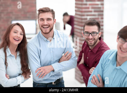 Smiling american team discussing business project during coffee Stock Photo