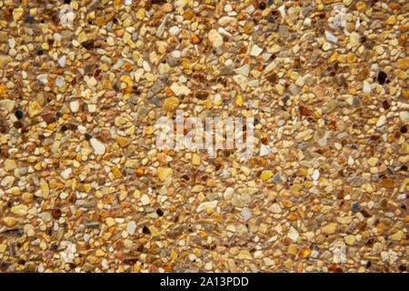 Sandstone or Stonewall background made up of small rocks and sand grains. Stock Photo