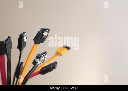 Red, black and yellow computer data cables. Data storage, network server infrastructure concept. Plenty of negative space. Stock Photo