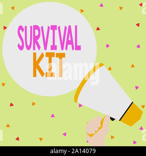 Handwriting text writing Survival Kit. Conceptual photo Emergency Equipment Collection of items to help someone Hand Holding Loudhailer Empty Round Sp Stock Photo