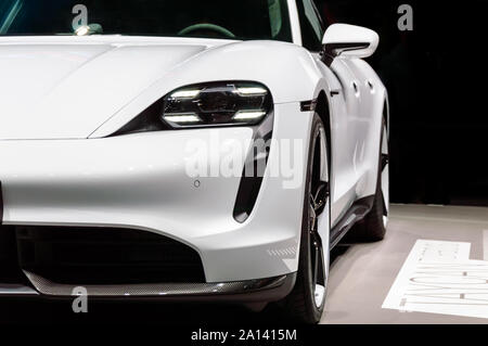 FRANKFURT - SEP 15, 2019: Close-up of white Porsche Taycan Turbo S: first fully electric Porsche sports car. Luxury supercar presented at IAA 2019 Fra Stock Photo