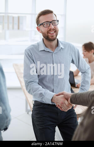 friendly business man shaking hands with his client Stock Photo