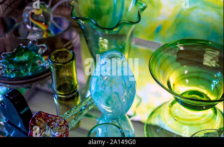 A variety of beautiful glass art is displayed in a glass shop in the USA Stock Photo