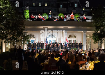 Washington, United States Of America. 20th Sep, 2019. Guests attending the State Dinner in honor of Australian Prime Minister Scott Morrison and his wife Mrs. Jenny Morrison watch a performance by the PresidentÕs Own Marine Chamber Orchestra and the United States Army Chorus Friday, Sept. 20, 2019, in the Rose Garden of the White House People: President Donald Trump Credit: Storms Media Group/Alamy Live News Stock Photo
