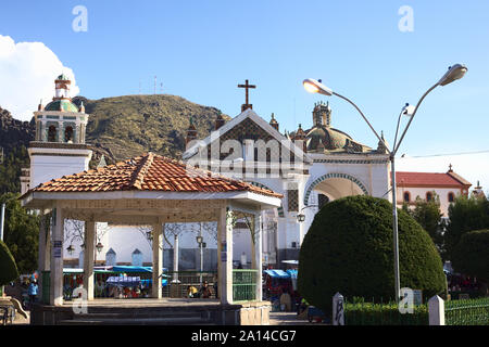 COPACABANA, BOLIVIA - OCTOBER 19, 2014: Pavillon on Plaza 2 de Febrero main square and the Basilica of Our Lady of Copacabana in Copacabana, Bolivia Stock Photo