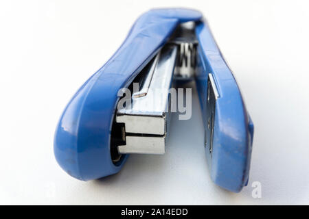 Blue stapler isolated on white background. Stock Photo