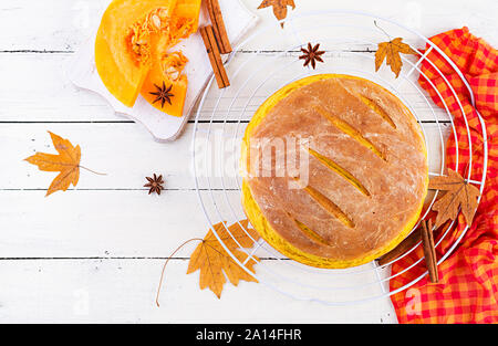 Fresh homemade pumpkin bread and pumpkin slices. Top view Stock Photo