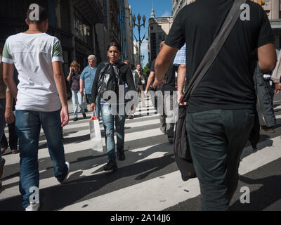 Buenos Aires, Argentina - March 21 2013: Pedestrians on the sreets of Buenos Aires city. This photo shows the downtown arround Plaza de Mayo. Stock Photo