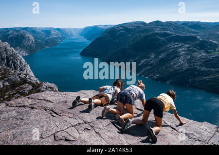 Preikestolen, Norway - August 1 2008: People trying to see the fiord from de top of Preikestolen. Stock Photo