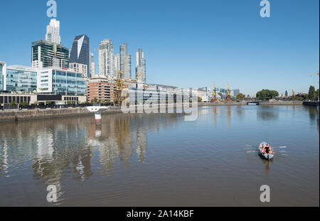 Buenos Aires, Argentina - March 31 2016: Life in Puerto Madero, the river and its buildings in Buenos Aires City. Stock Photo