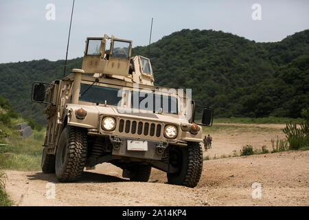 U.S. Marines drive a Humvee at the Sanseori Range in Pohang, Republic of Korea. Stock Photo