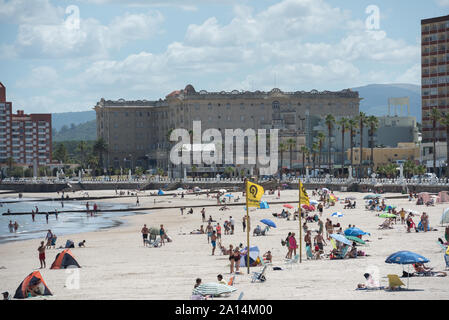 Piriapolis, Uruguay - March 4 2016: The main beach of the city and the Argentino hotel on the background. Stock Photo