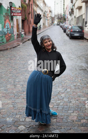 Buenos Aires, Argentina - September 7 2013: Local people waving in the streets of San Telmo, Buenos Aires city. Stock Photo