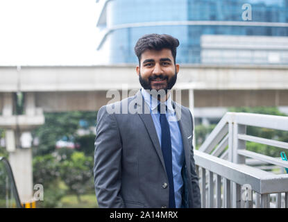 Young Indian businesswoman with a file in urban city Stock Photo