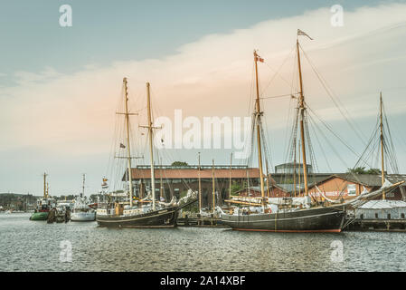 Old sailingboats at a jetty in the port of Svendborg, Denmark, July 13, 2019 Stock Photo