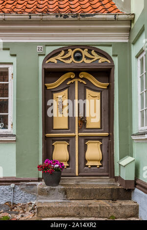 a nice painted entrance door and stairs, Ærøskøbing, Denmark, July 13, 2019 Stock Photo
