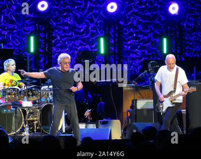 Tampa, United States. 22nd Sep, 2019. September 22, 2019 - Tampa, Florida, United States - Zak Starkey (from left), Roger Daltrey and Pete Townshend of the English rock band The Who perform with members of a 48-piece orchestra at the Amalie Arena on the second leg of their Moving On! tour on September 22, 2019 in Tampa, Florida. Credit: Paul Hennessy/Alamy Live News Stock Photo