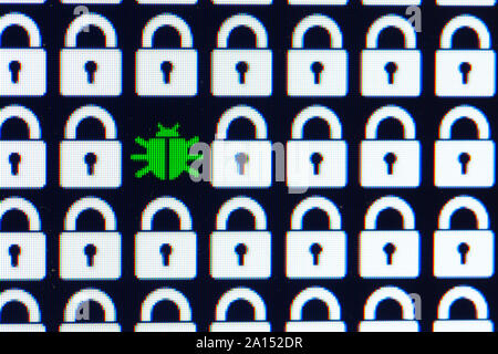 Bug as a symbol of malware and a Trojan virus in the program code. Hacking and theft of personal information and data. White pixel locks and Green Bug on a black background, close-up. Stock Photo