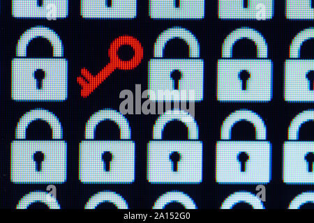 Key as a symbol of access or hacking of open personal information. Universal access password. White pixel locks and a red key on a black background, close-up. Stock Photo