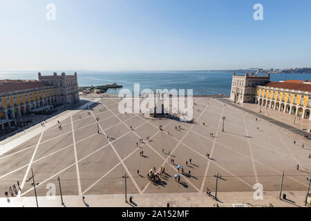View of Tagus River and people and statue of King Jose I at Praca do Comercio square in Baixa district in Lisbon, Portugal, from above on a sunny day. Stock Photo