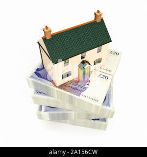 House on a stack of UK 20 pound notes GBP sterling Stock Photo