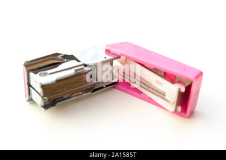 Small pink stapler isolated on white background. Stock Photo