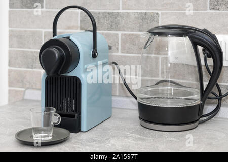 Coffee machine and electric kettle in the kitchen Stock Photo