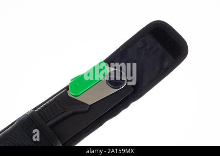 Close up of a folding handsaw in pouch isolated on white Stock Photo