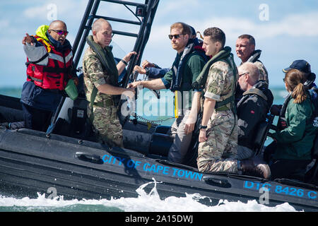 The Duke of Sussex travels on a South African Maritime Police Unit RIB during a visit to Kalk Bay Harbour, in Cape Town on day two of the Royal couple's visit to South Africa. Stock Photo