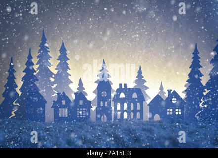 Paper winter landscape with village and Christmas trees in snow night. Christmas season and Happy new year season. Scenery on the window made from pap Stock Photo