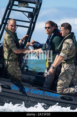 The Duke of Sussex travels on a South African Maritime Police Unit RIB during a visit to Kalk Bay Harbour, in Cape Town, on day two of the Royal couple's visit to South Africa. Stock Photo