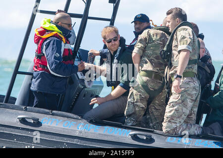 The Duke of Sussex travels on a South African Maritime Police Unit RIB during a visit to Kalk Bay Harbour, in Cape Town, on day two of the Royal couple's visit to South Africa. Stock Photo