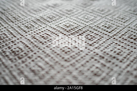 Close up of perforated kitchen paper with diamond pattern Stock Photo