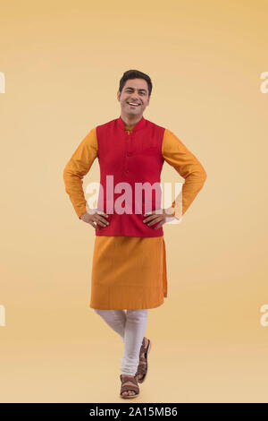 An Indian man in white with orange and yellow turban Stock Photo - Alamy