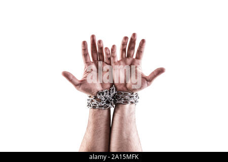 Two hands in chains isolated on white background with clipping path Stock Photo