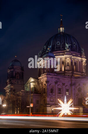 Berlin, Germany - December 12, 2018: Christmas street light decoration with Illuminated Neo-Renaissance Berlin Cathedral (Berliner Dom) or Evangelical Stock Photo